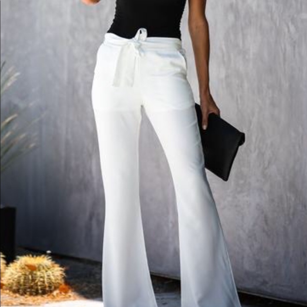 Flared white pants